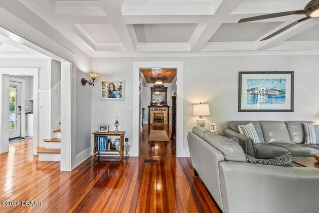509 Faulkner St, New Smyrna Beach, FL 32168 - living room with dark hardwood / wood-style flooring, coffered ceiling, and ornamental molding