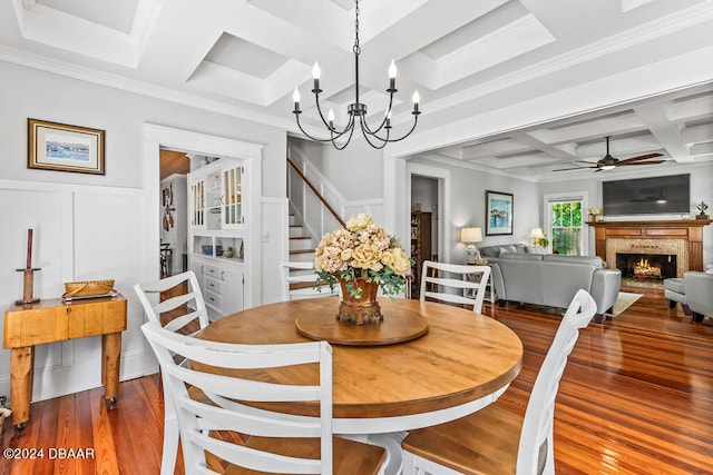 509 Faulkner St, New Smyrna Beach, FL 32168 - dining area with hardwood / wood-style flooring, beamed ceiling, ceiling fan with notable chandelier, crown molding, and coffered ceiling
