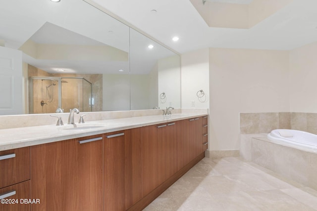 bathroom featuring vanity, tile patterned floors, and separate shower and tub