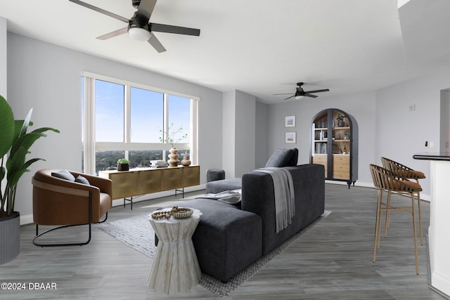 living room featuring ceiling fan and wood-type flooring