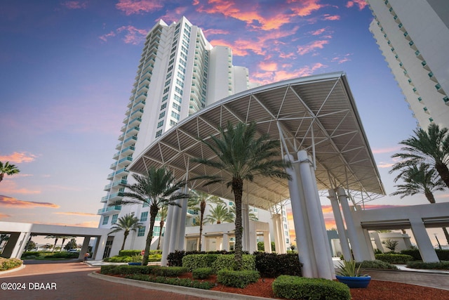 view of outdoor building at dusk