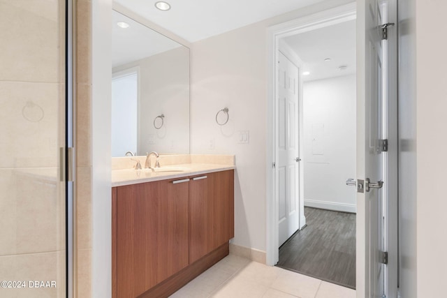 bathroom with vanity and hardwood / wood-style flooring