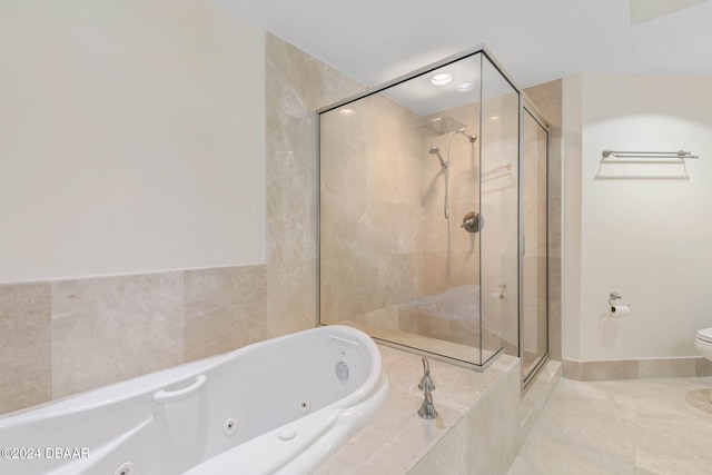 bathroom featuring toilet, independent shower and bath, and tile patterned floors