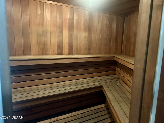 view of sauna / steam room featuring wood walls