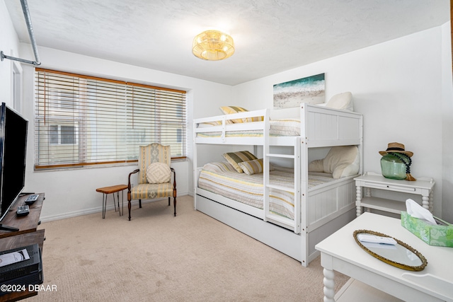 carpeted bedroom featuring multiple windows