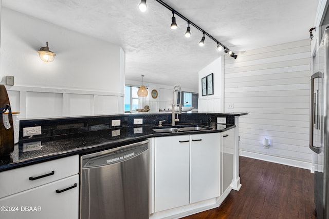 kitchen with dishwasher, dark wood-type flooring, white cabinets, and sink