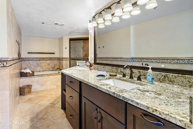 bathroom featuring vanity and a bathing tub