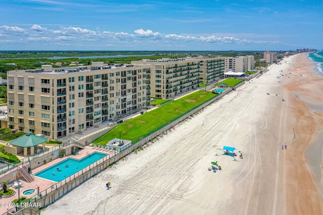 bird's eye view featuring a beach view and a water view