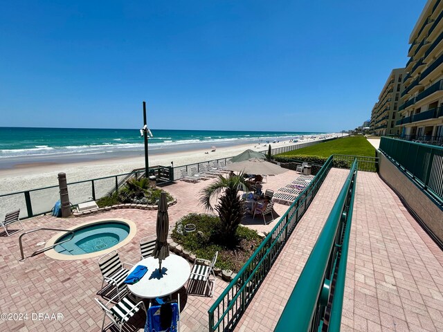 property view of water featuring a beach view