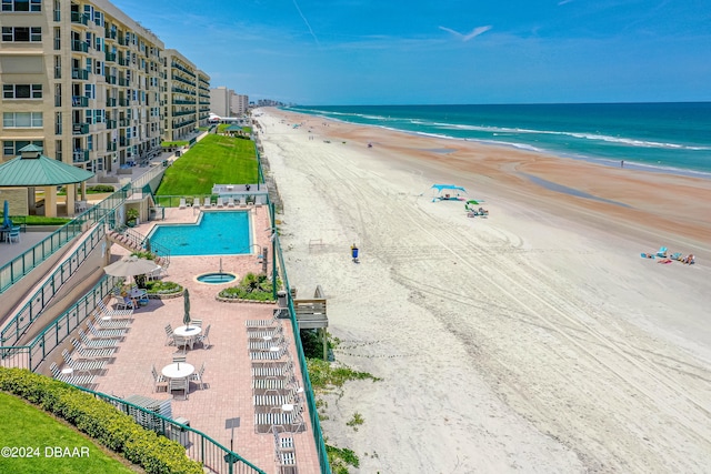 drone / aerial view with a view of the beach and a water view