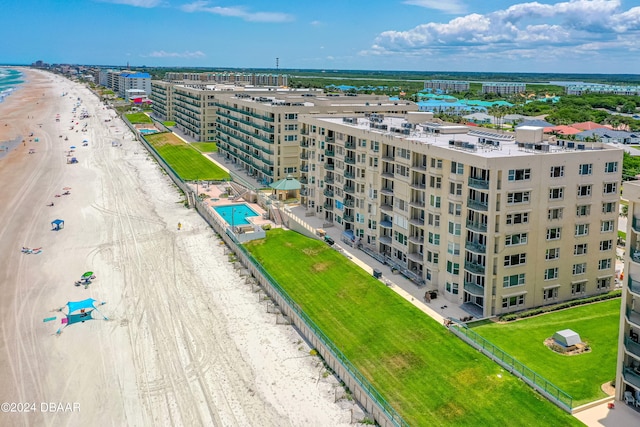 drone / aerial view with a view of the beach and a water view