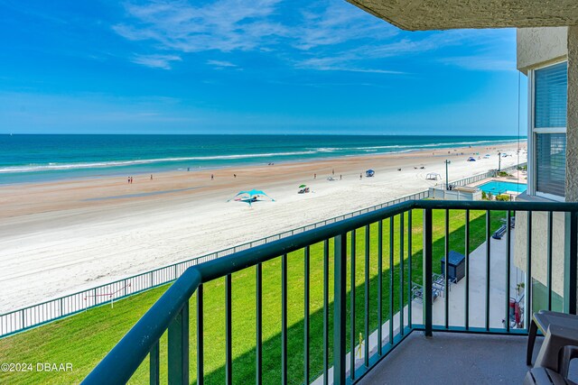 balcony with a beach view and a water view