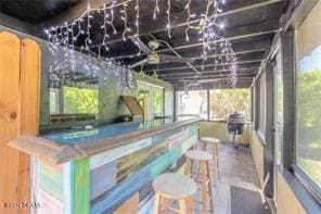 bar featuring concrete floors