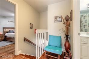 sitting room with hardwood / wood-style floors