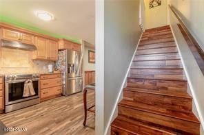 staircase featuring wood-type flooring