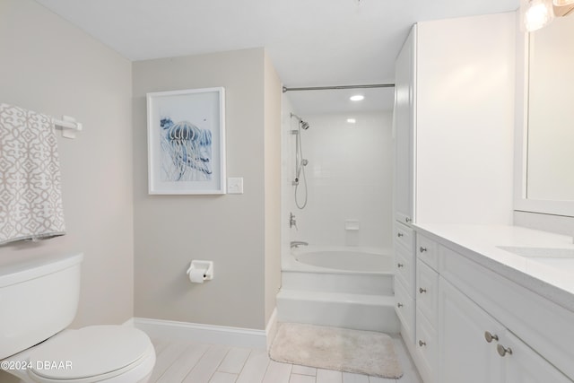 full bathroom with vanity, toilet, and tiled shower / bath