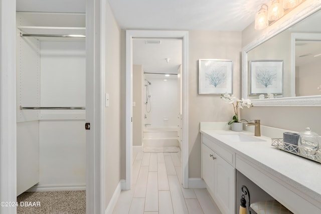 bathroom featuring vanity and tub / shower combination