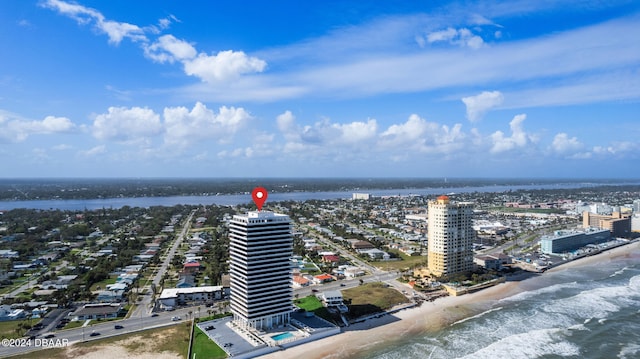 drone / aerial view with a beach view and a water view