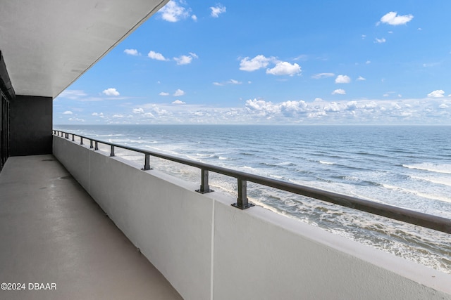 balcony with a view of the beach and a water view