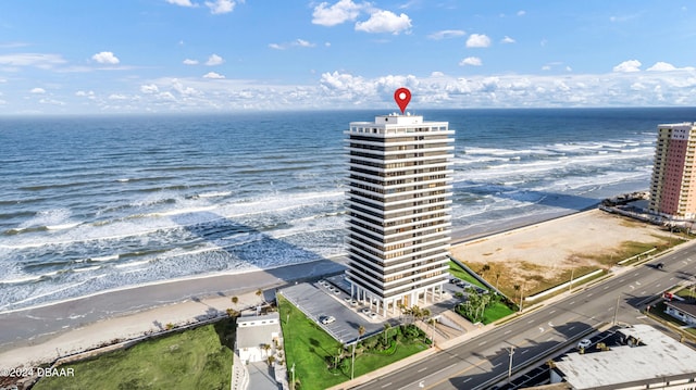 birds eye view of property featuring a view of the beach and a water view