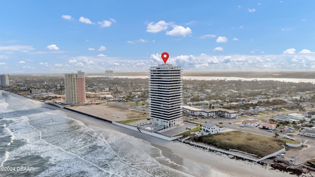 birds eye view of property featuring a view of the beach and a water view