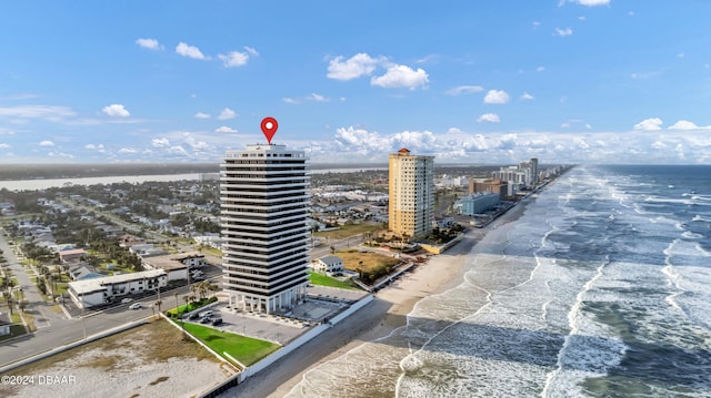 aerial view with a water view and a view of the beach