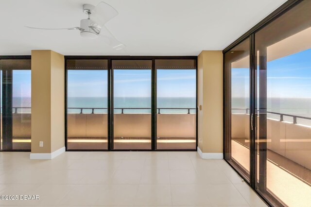 2200 N Atlantic Ave Unit 1602, Daytona Beach, FL 32118 - unfurnished room with a wealth of natural light, floor to ceiling windows, and a water view