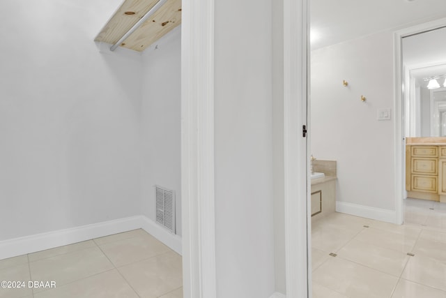 interior space featuring tile patterned flooring and vanity