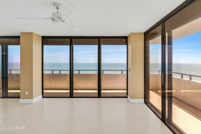 2200 N Atlantic Ave Unit 1602, Daytona Beach, FL 32118 - unfurnished room featuring floor to ceiling windows, a water view, and a healthy amount of sunlight