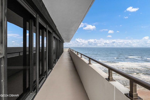 balcony featuring a water view