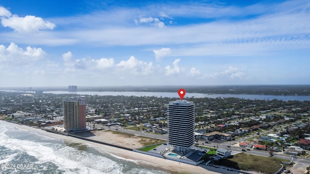 bird's eye view with a water view and a view of the beach