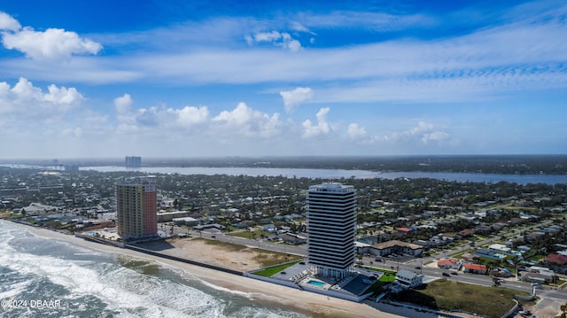 birds eye view of property with a beach view and a water view