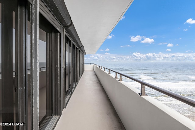 balcony featuring a water view