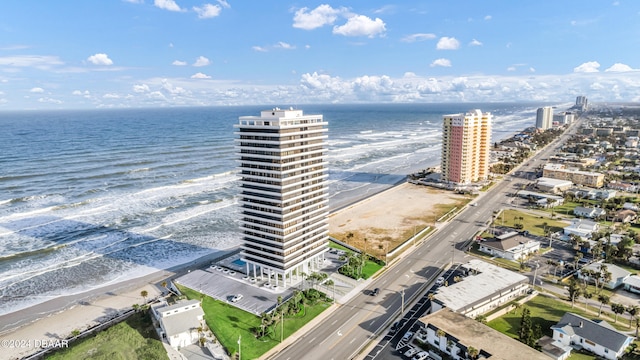 drone / aerial view with a view of the beach and a water view