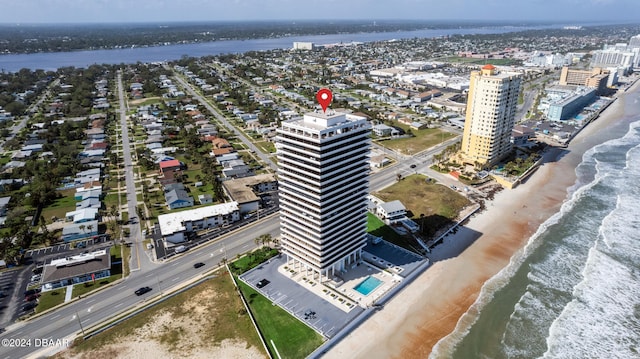 bird's eye view with a beach view and a water view