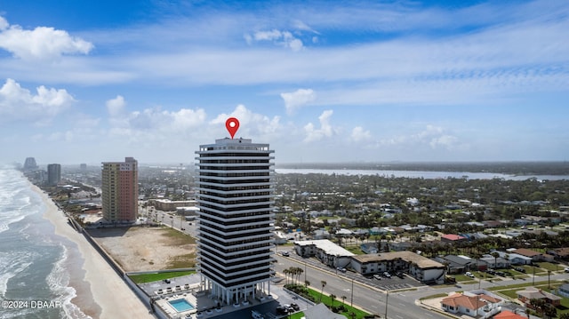 birds eye view of property featuring a water view and a view of the beach