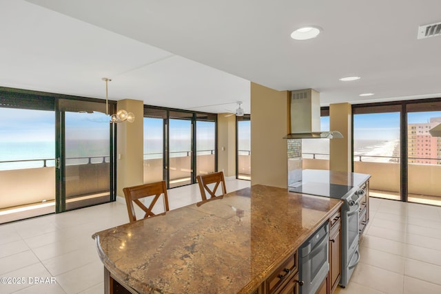 2200 N Atlantic Ave Unit 1602, Daytona Beach, FL 32118 - kitchen with a healthy amount of sunlight, electric stove, floor to ceiling windows, visible vents, and wall chimney exhaust hood