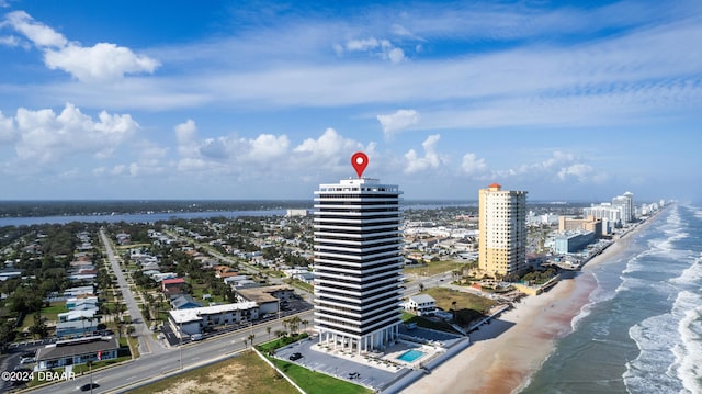 aerial view featuring a view of the beach and a water view