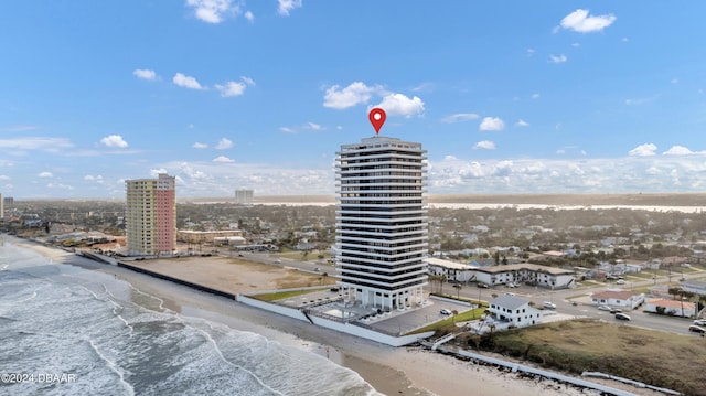 exterior space featuring a view of the beach and a water view