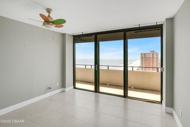 2200 N Atlantic Ave Unit 1602, Daytona Beach, FL 32118 - empty room with baseboards, floor to ceiling windows, and ceiling fan