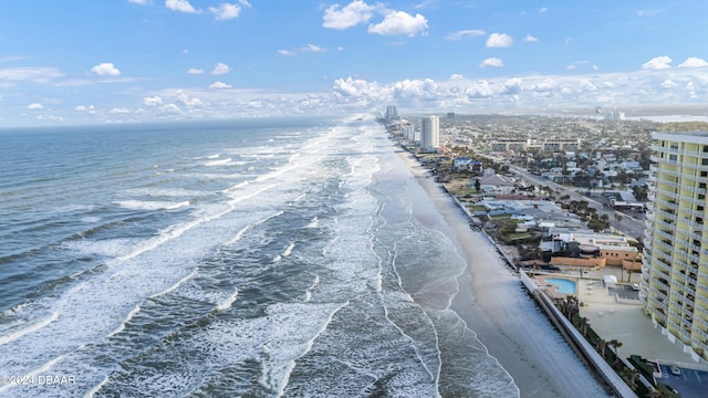 birds eye view of property featuring a view of the beach and a water view