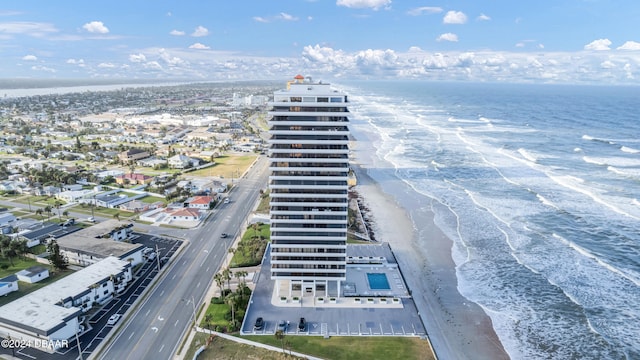 birds eye view of property featuring a view of the beach and a water view