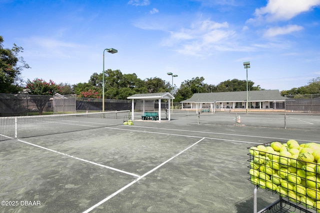 view of sport court with fence