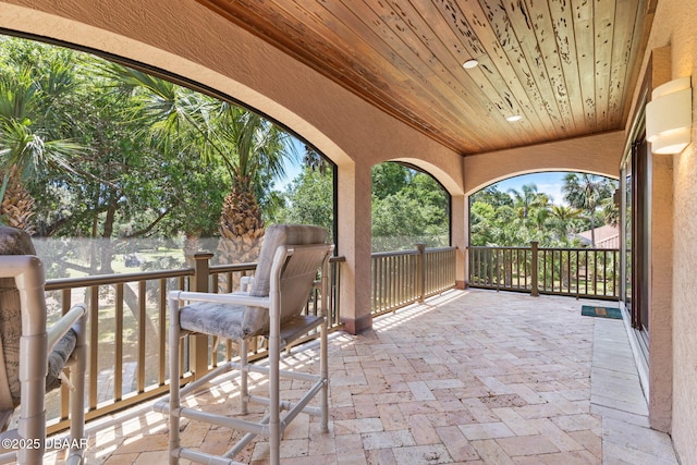 view of patio / terrace with a wall mounted air conditioner