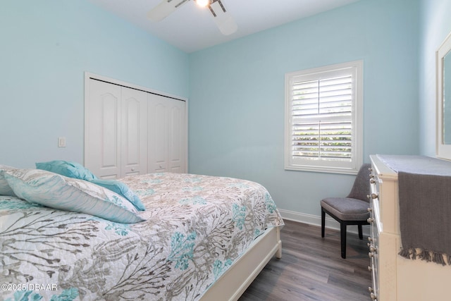 bedroom featuring baseboards, a closet, a ceiling fan, and dark wood-type flooring