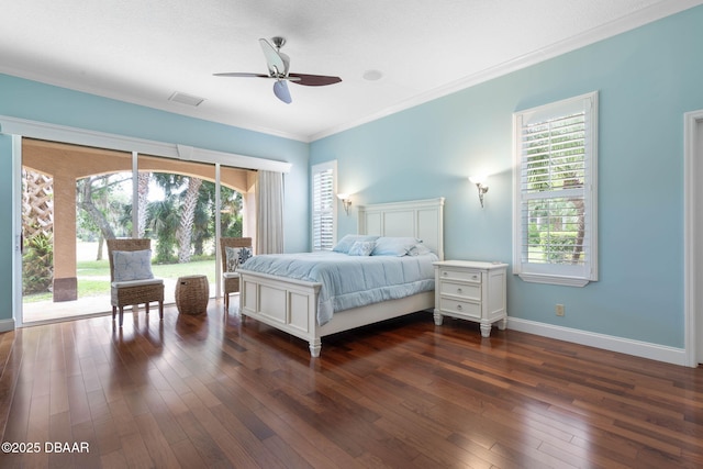 bedroom featuring a ceiling fan, ornamental molding, dark wood-style floors, and visible vents