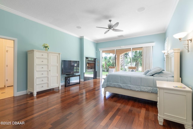 bedroom with ornamental molding, visible vents, dark wood-style floors, and access to exterior