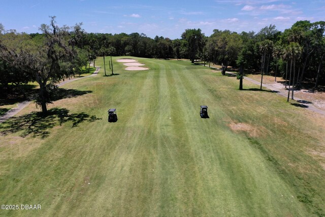 birds eye view of property with view of golf course