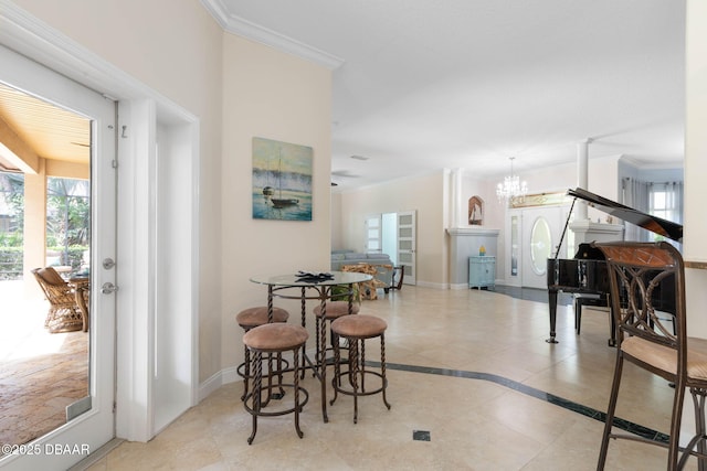 interior space with tile patterned floors, ornamental molding, and an inviting chandelier