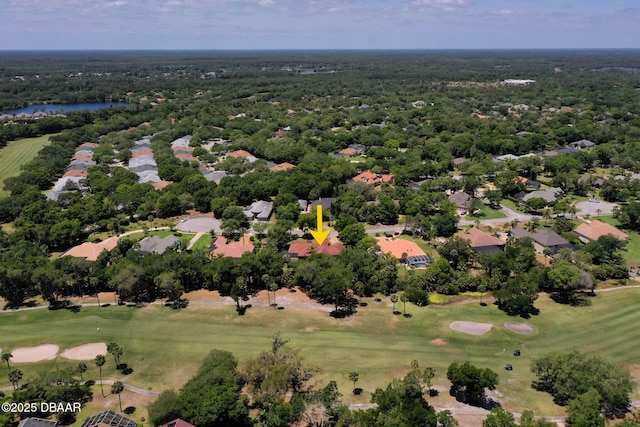 drone / aerial view featuring a water view, a residential view, and view of golf course
